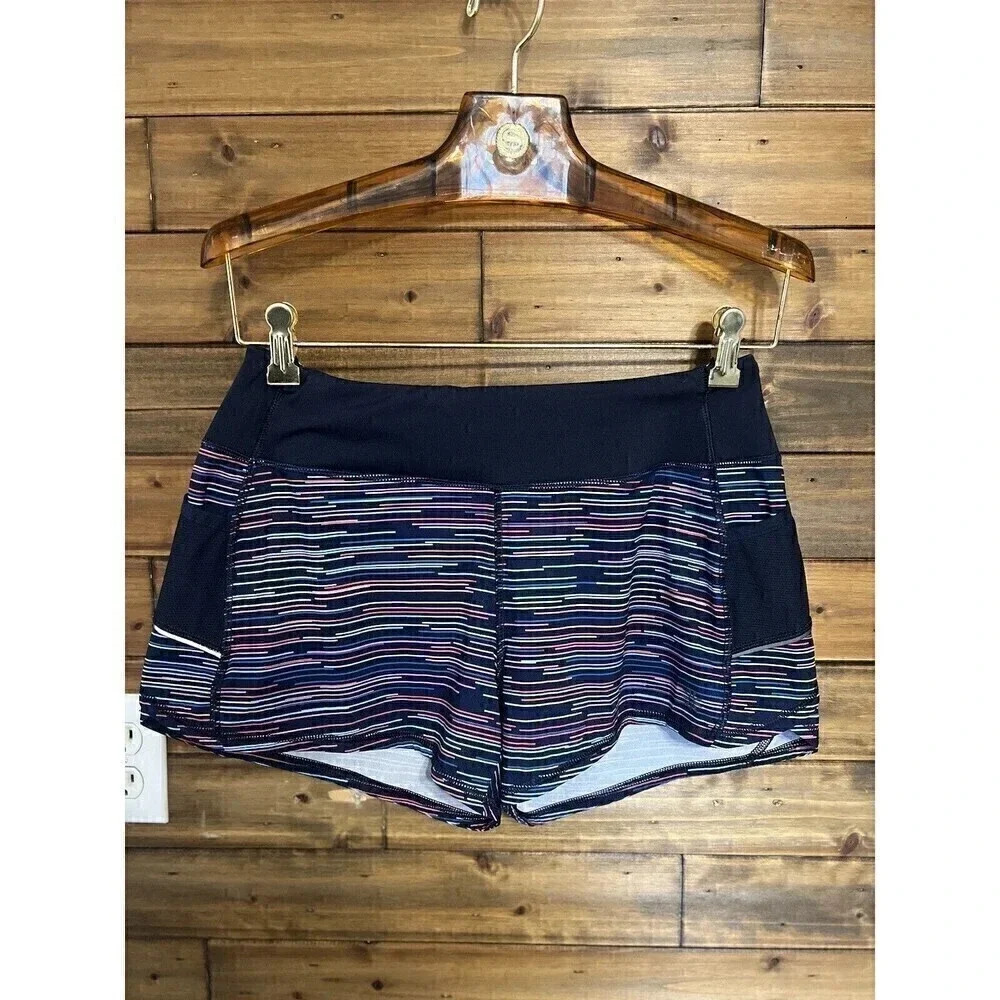 Athleta woman's running shorts size Small Navy blue with multi-color stripes